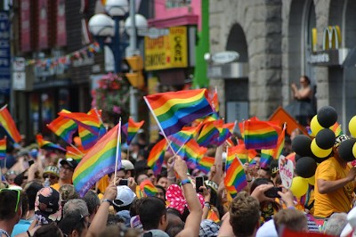  Celebration of the LGBT community with a crowd waving rainbow flags