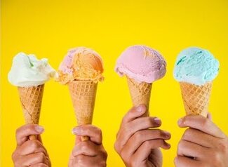 Four ice cream cones each being held by a hand.