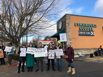 Workers protesting at a Starbucks location.